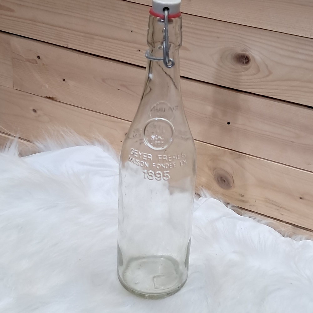 Vintage clear glass Geyer-Freres bottle